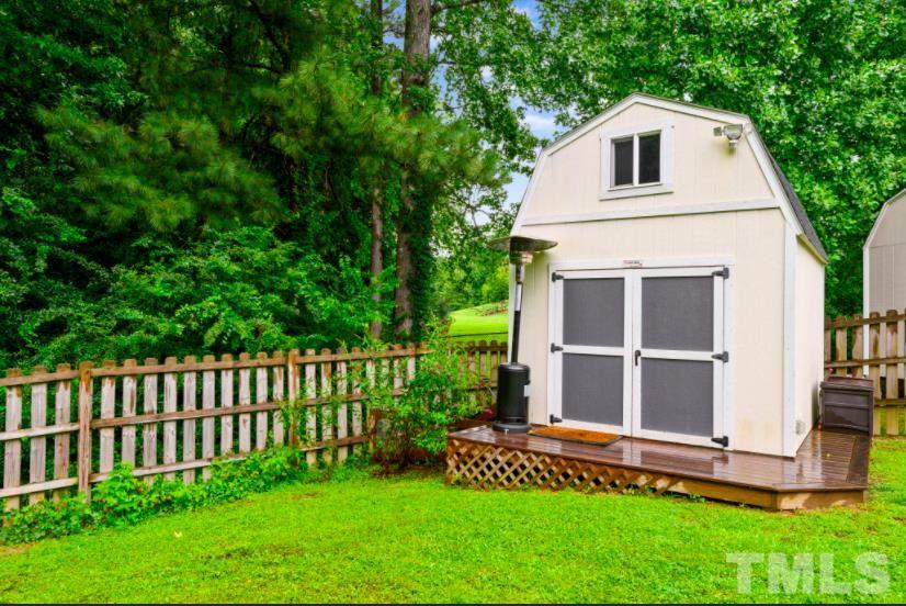 7050 Jeffreys Creek Lane Raleigh, NC 27616 - Photo 23 of 23 a view of a house with a yard and sitting area