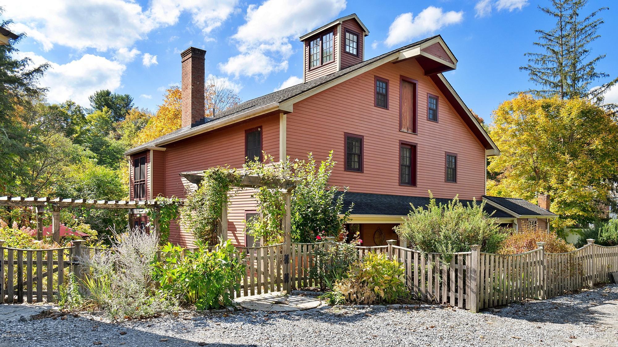 1204 Ashley Falls Road Sheffield, MA 01257 - Photo 2 of 55 a front view of a house with a garden