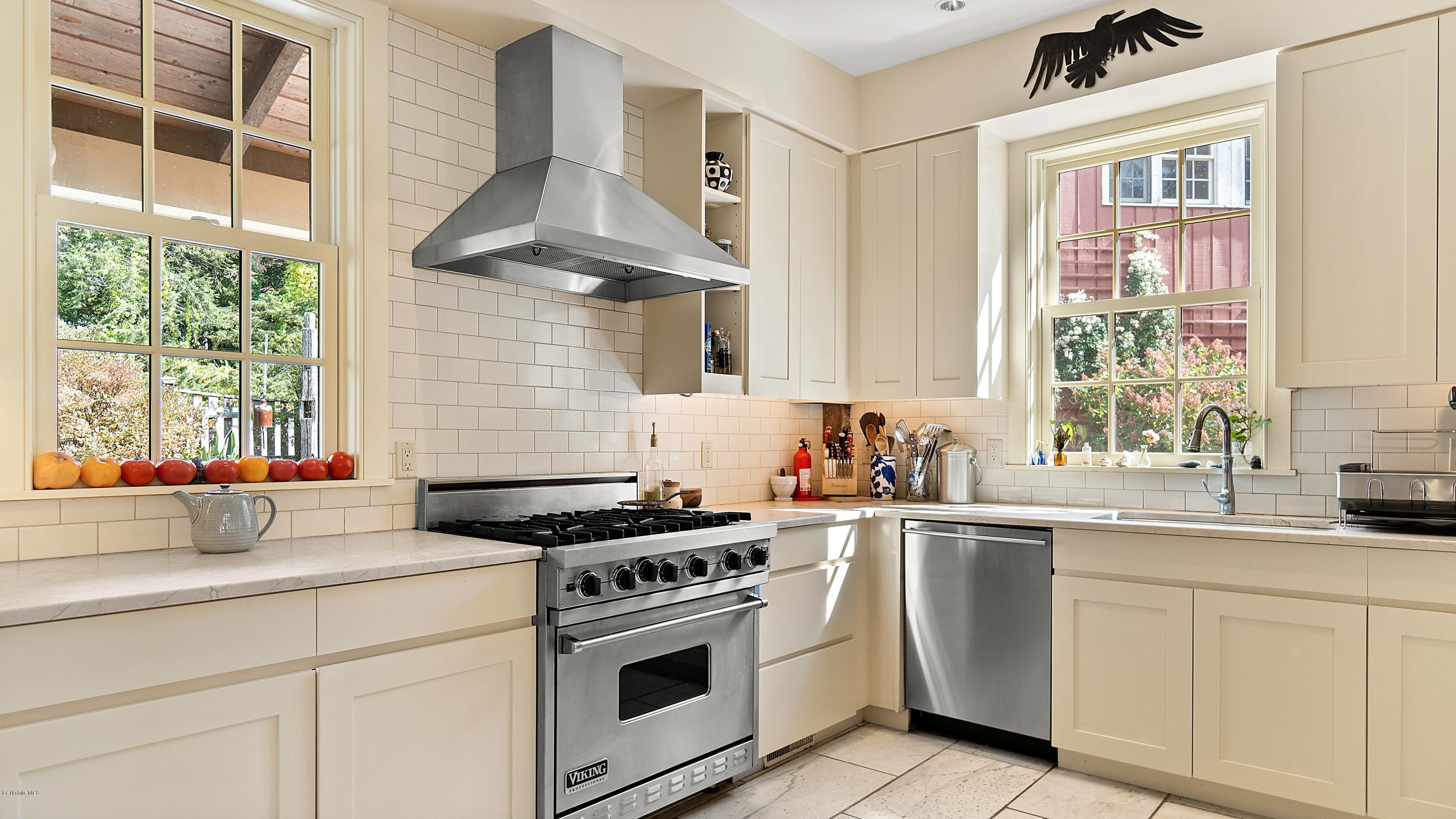 1204 Ashley Falls Road Sheffield, MA 01257 - Photo 12 of 55 a kitchen with cabinets appliances a sink and a window