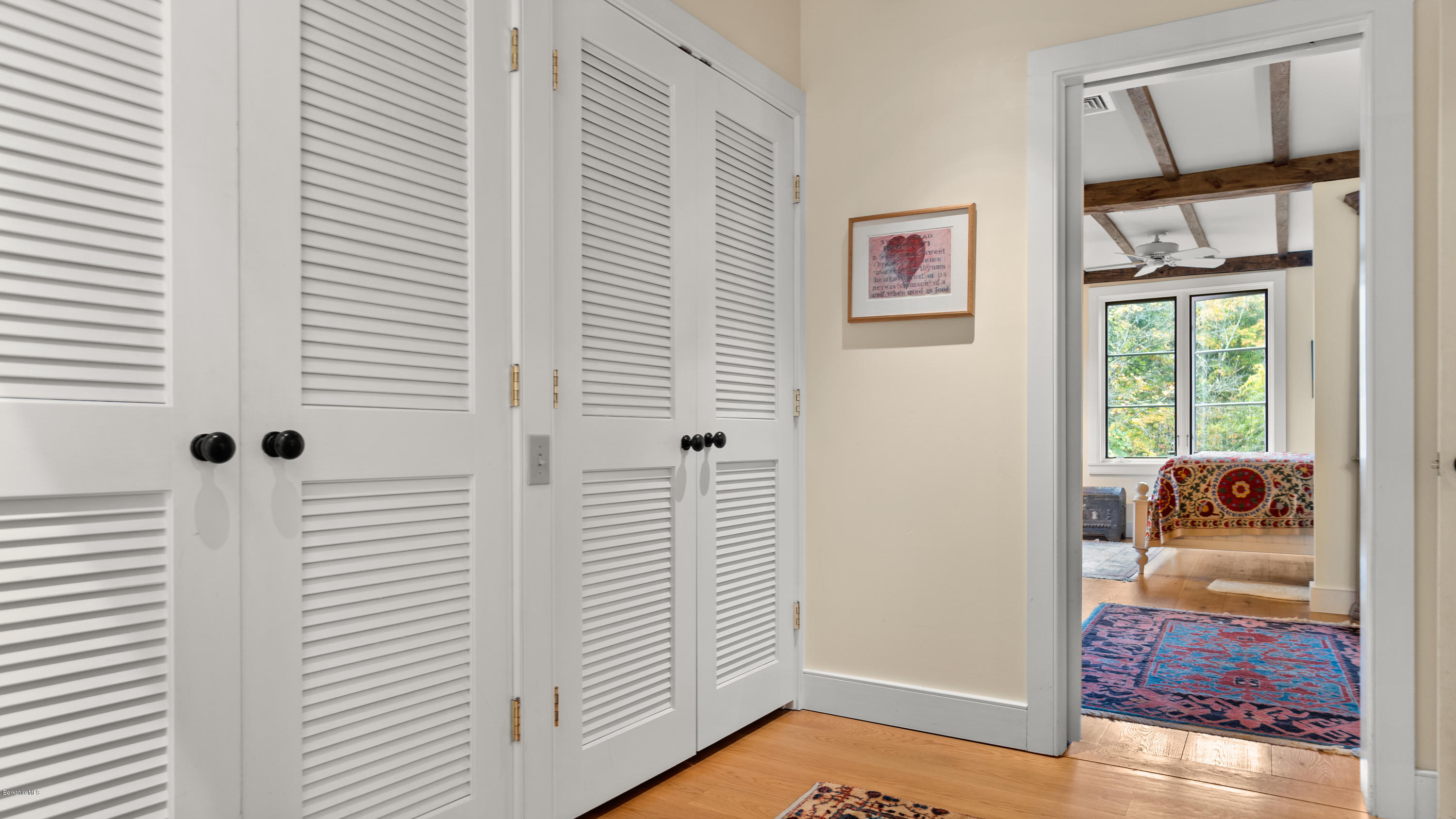 1204 Ashley Falls Road Sheffield, MA 01257 - Photo 20 of 55 a view of a bedroom with wooden floor and furniture