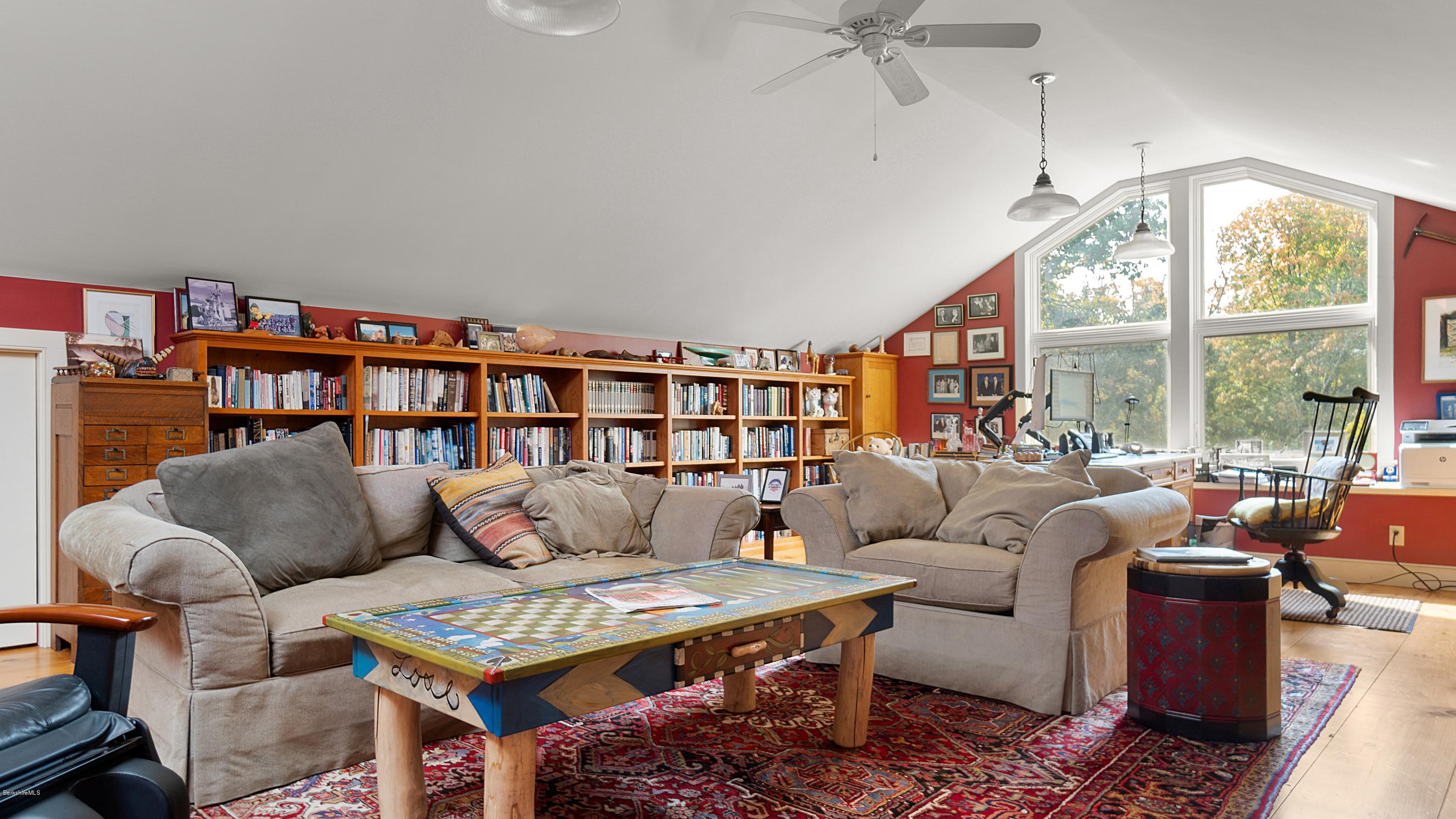 1204 Ashley Falls Road Sheffield, MA 01257 - Photo 32 of 55 a living room with furniture a rug and a large window