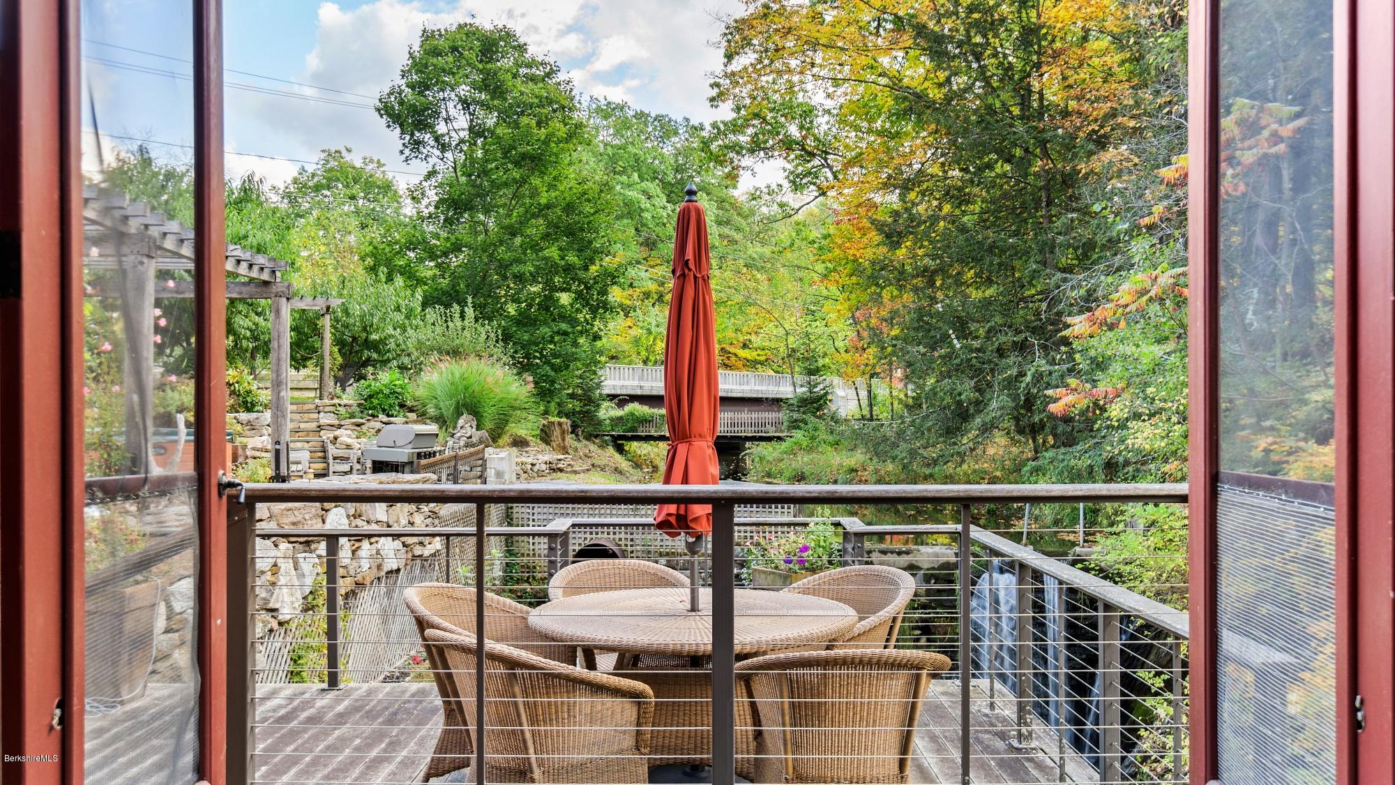 1204 Ashley Falls Road Sheffield, MA 01257 - Photo 36 of 55 a view of a balcony with chair and wooden floor