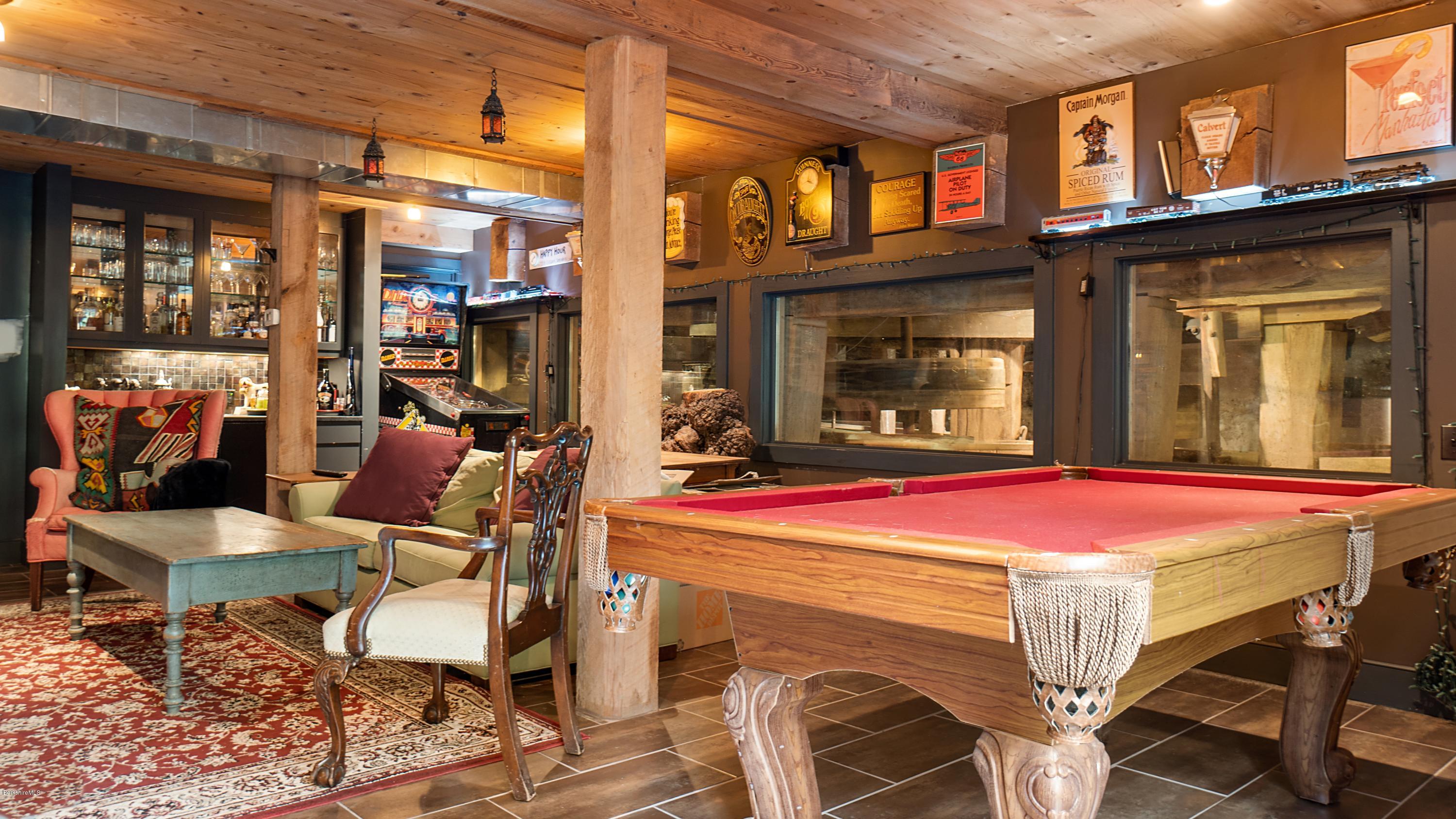 1204 Ashley Falls Road Sheffield, MA 01257 - Photo 37 of 55 a patio with a table and chairs and potted plants