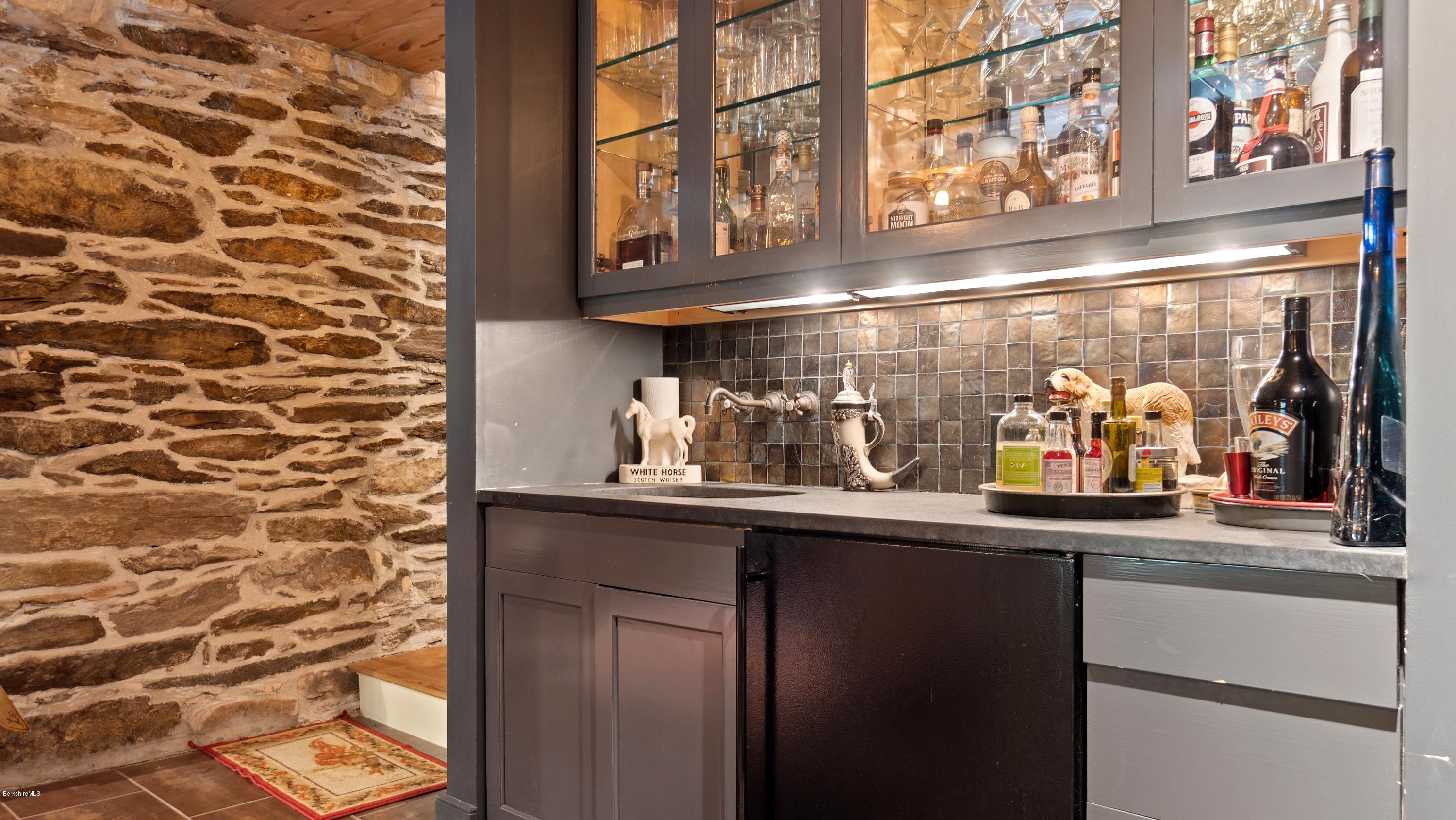 1204 Ashley Falls Road Sheffield, MA 01257 - Photo 38 of 55 a kitchen with a sink and cabinets