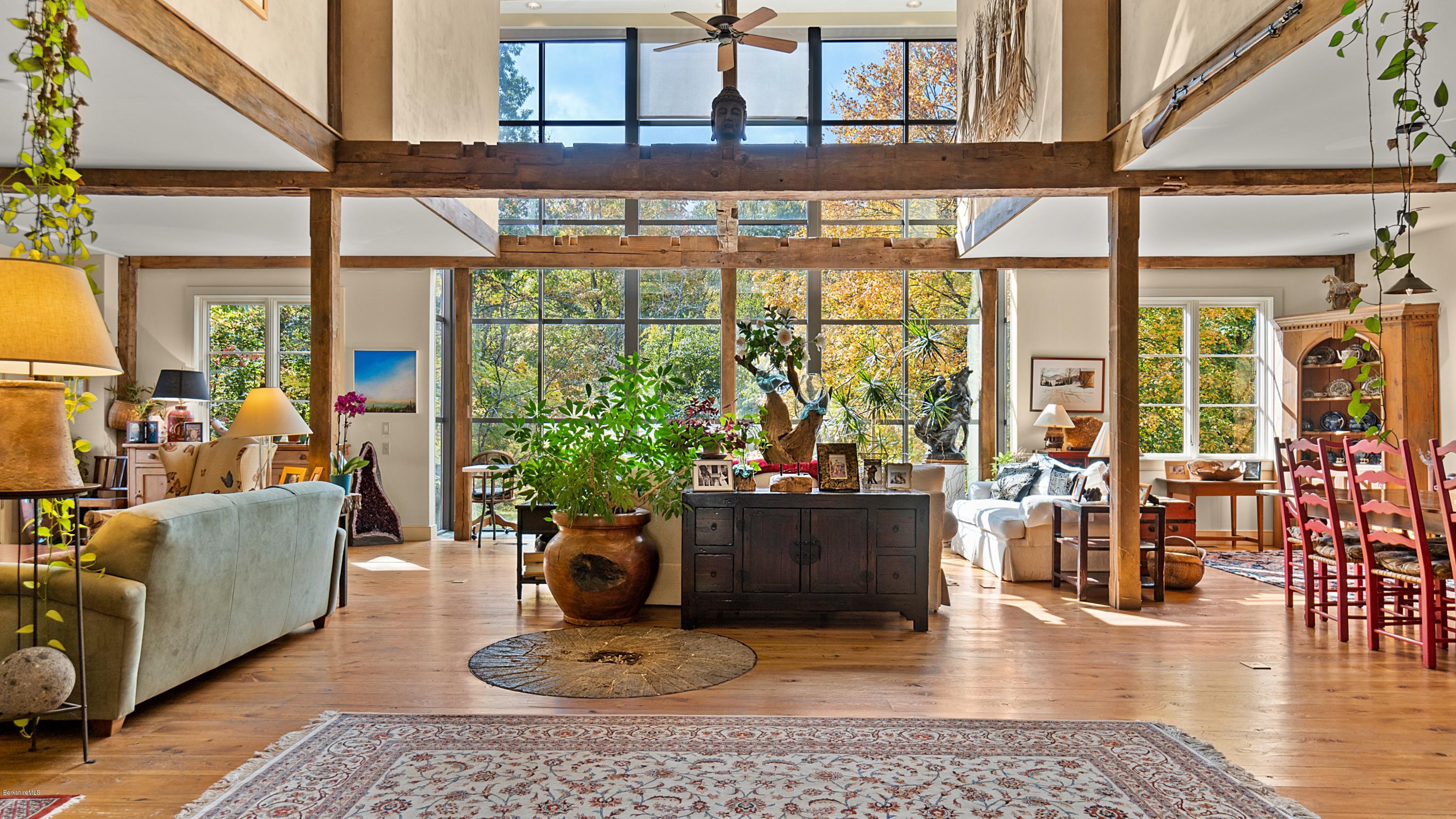 1204 Ashley Falls Road Sheffield, MA 01257 - Photo 5 of 55 a living room with furniture and floor to ceiling windows
