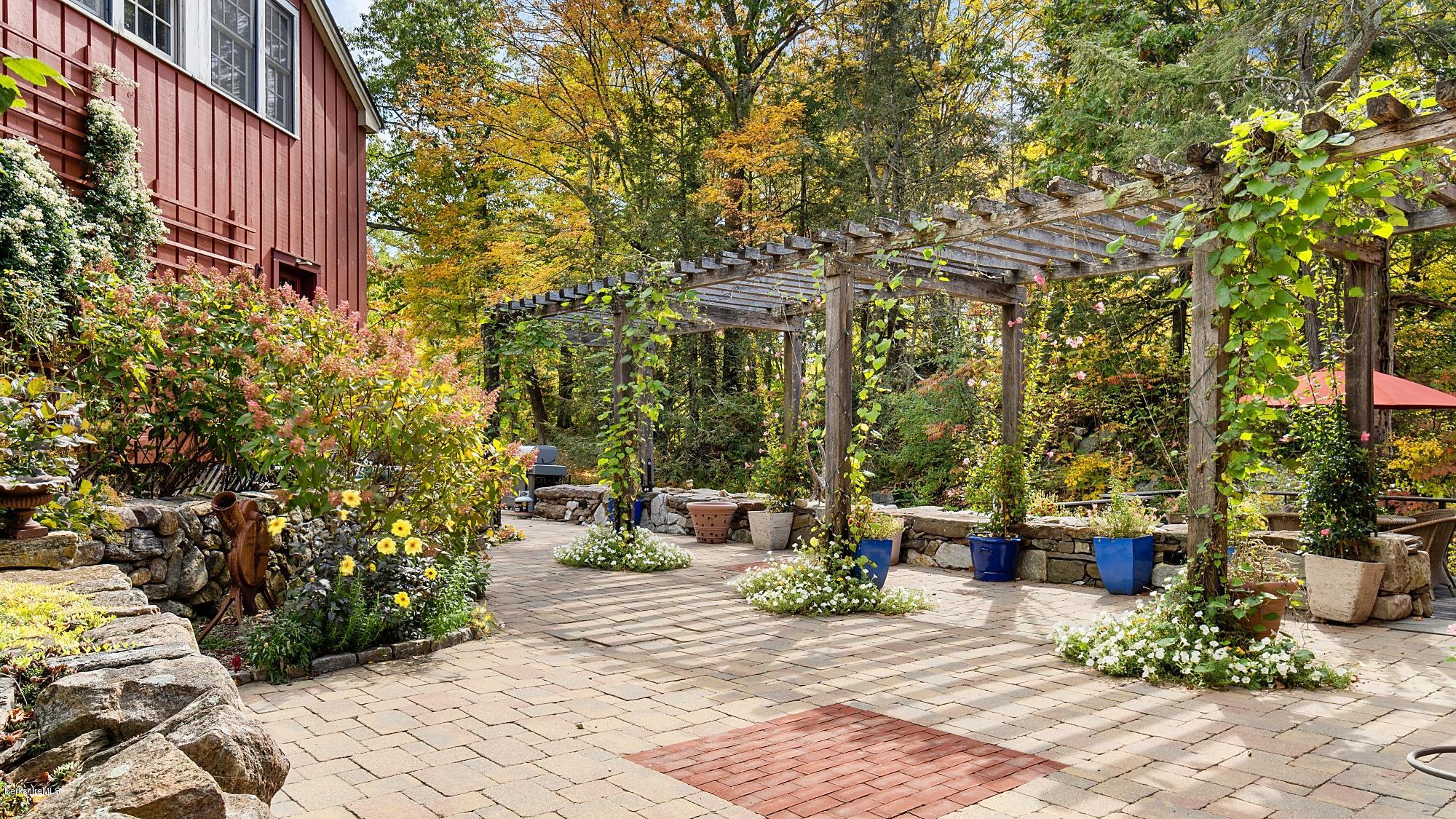 1204 Ashley Falls Road Sheffield, MA 01257 - Photo 42 of 55 a view of a patio with table and chairs and potted plants