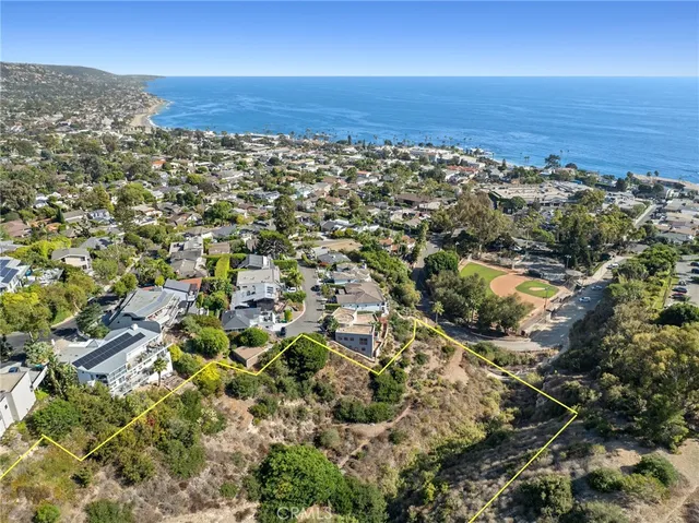 an aerial view of residential building and green space