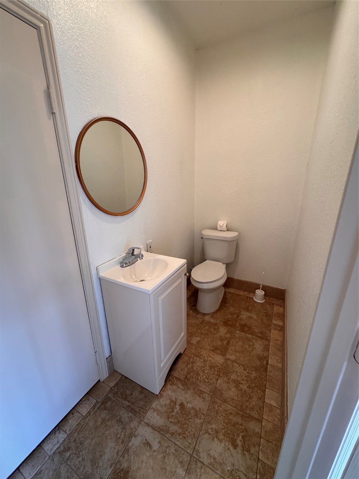 134 April Point Drive South Conroe, TX 77356 - Photo 13 of 31 a bathroom with a sink a toilet and a mirror