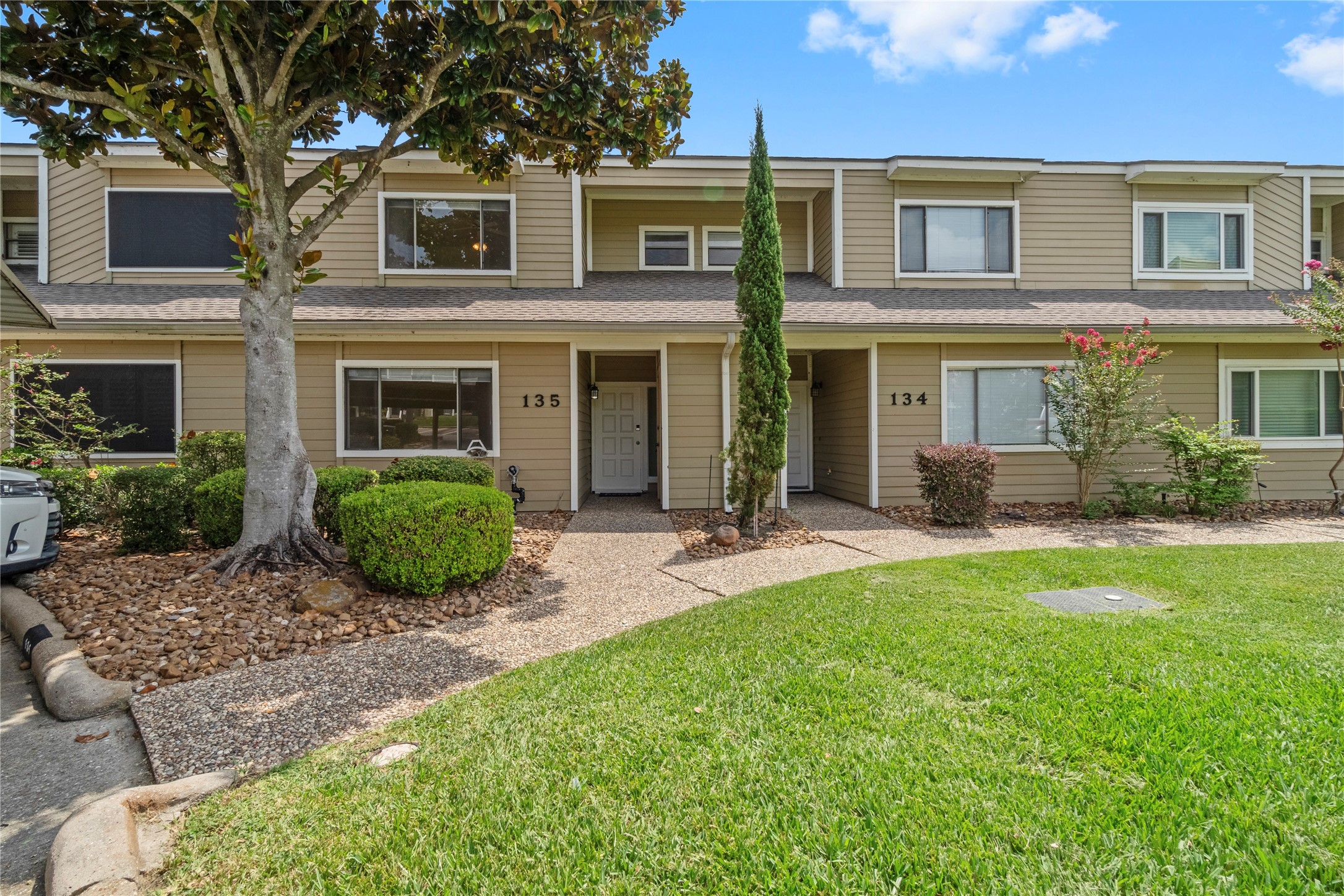 134 April Point Drive South Conroe, TX 77356 - Photo 20 of 31 a view of a house with a yard and plants