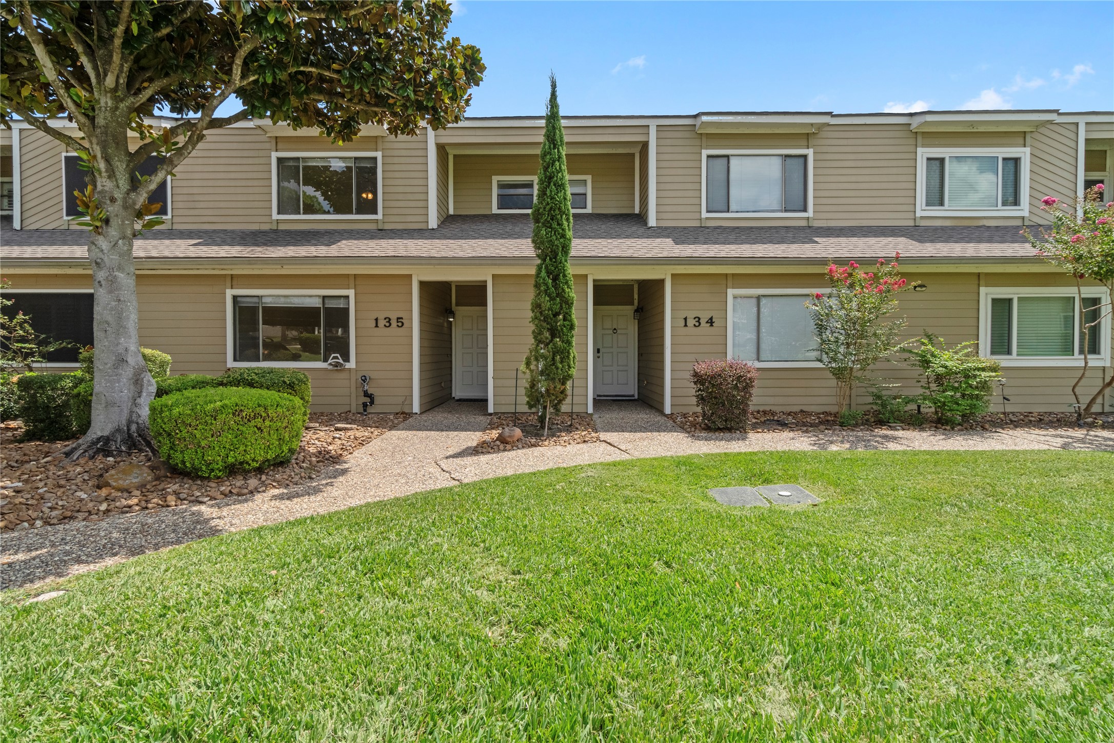 134 April Point Drive South Conroe, TX 77356 - Photo 22 of 31 a view of a house with a yard and plants