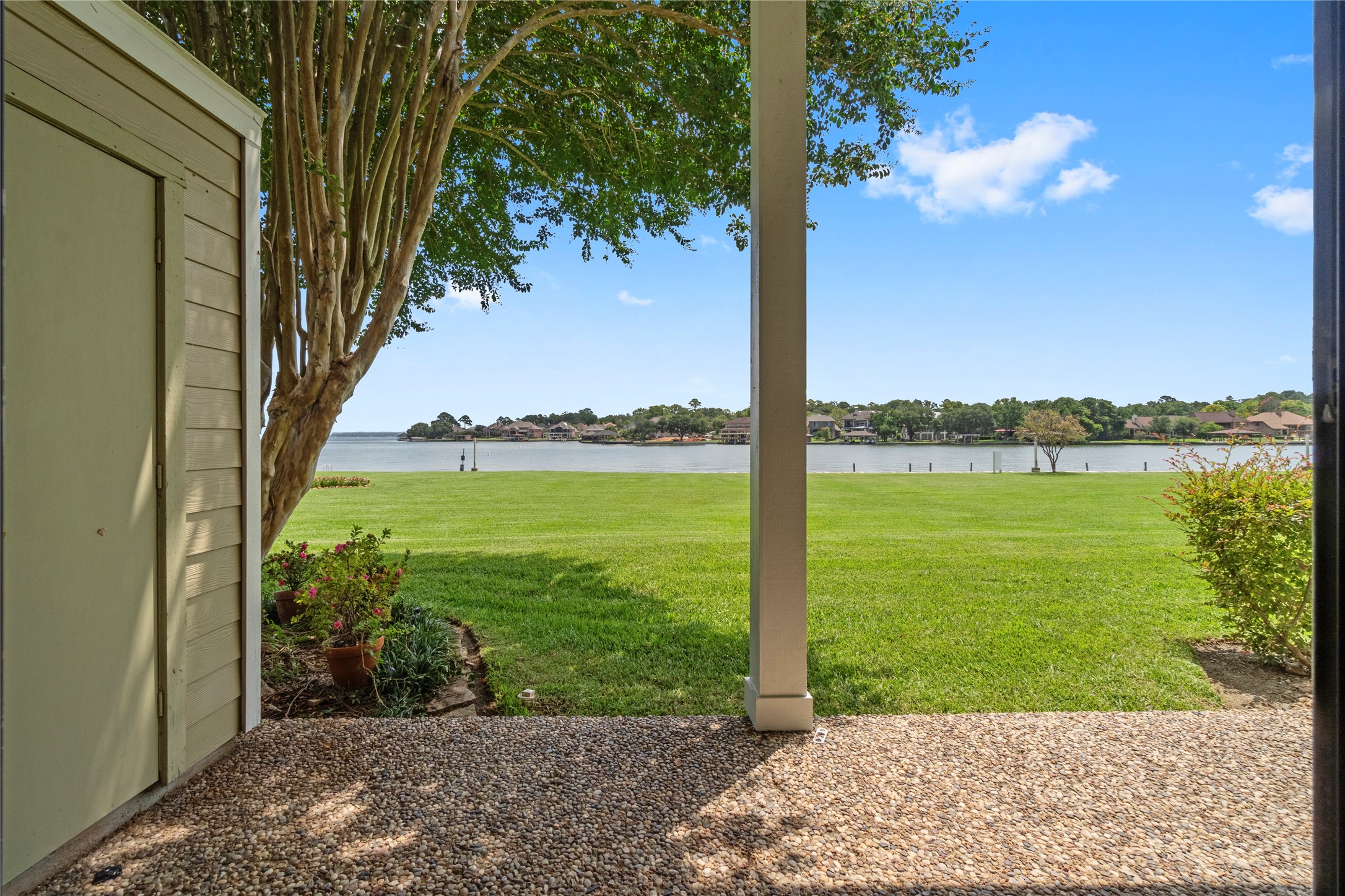 134 April Point Drive South Conroe, TX 77356 - Photo 23 of 31 a view of a lake with a big yard
