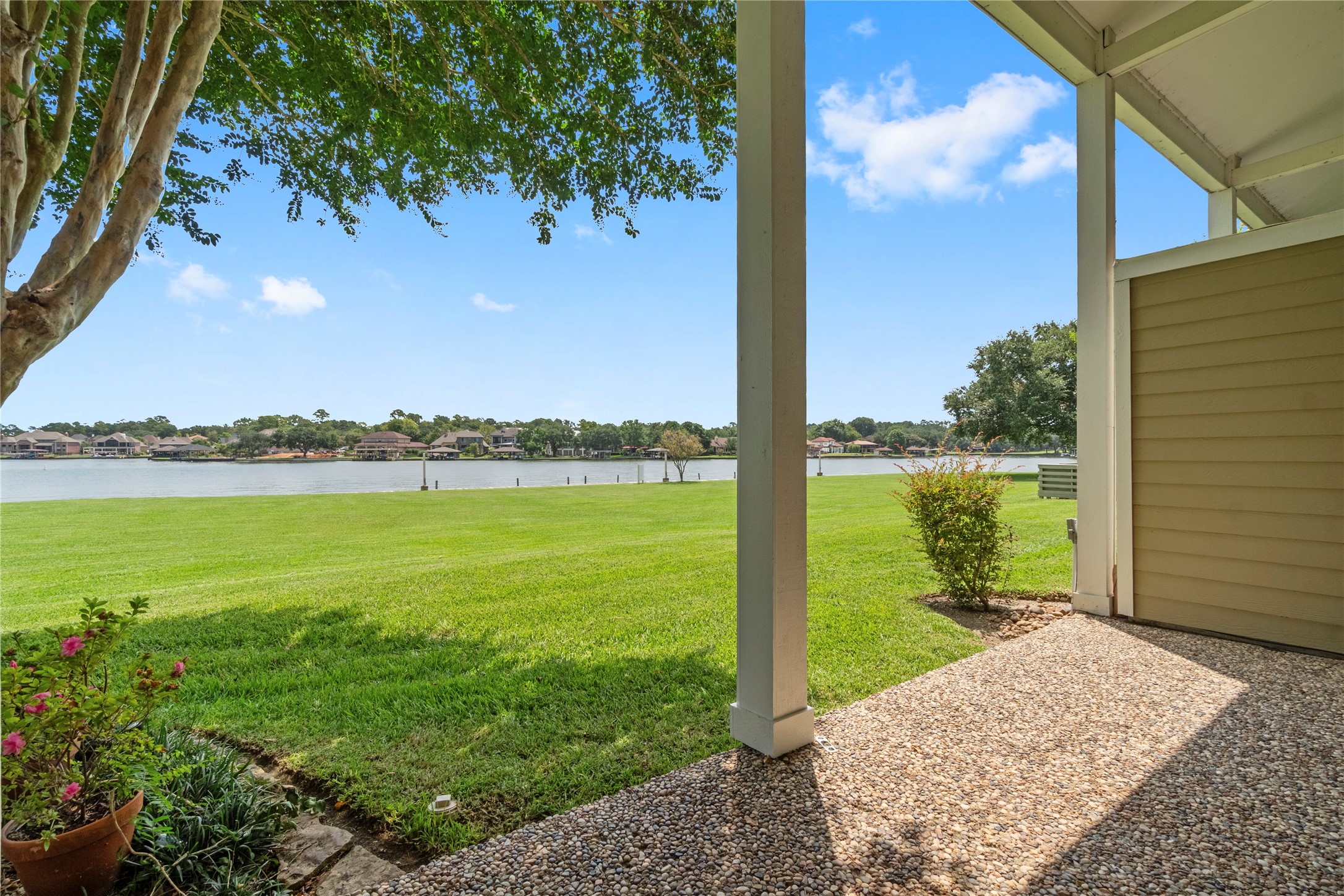 134 April Point Drive South Conroe, TX 77356 - Photo 24 of 31 a view of a lake with a big yard