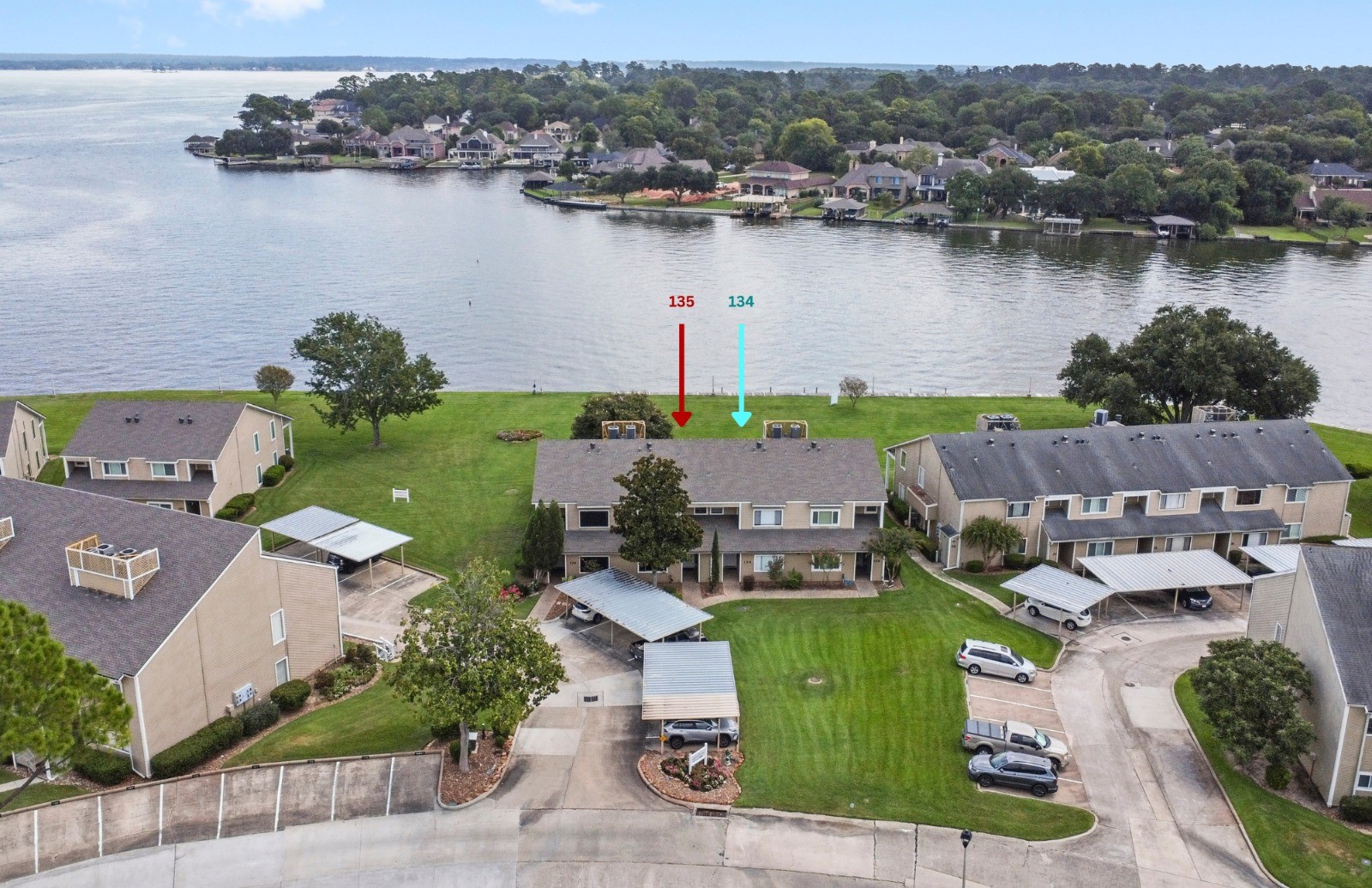 134 April Point Drive South Conroe, TX 77356 - Photo 4 of 31 an aerial view of a house with a lake view