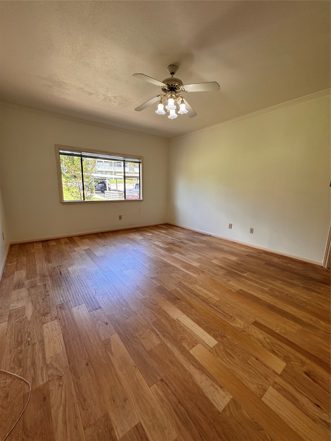 134 April Point Drive South Conroe, TX 77356 - Photo 5 of 31 wooden floor in an empty room with a window