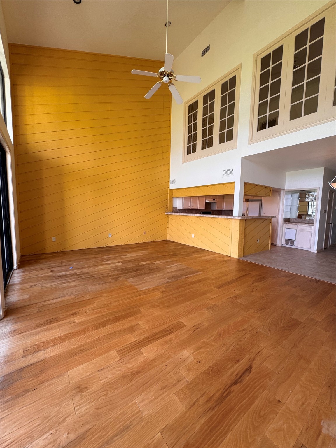 134 April Point Drive South Conroe, TX 77356 - Photo 7 of 31 a view of an empty room with wooden floor and a window