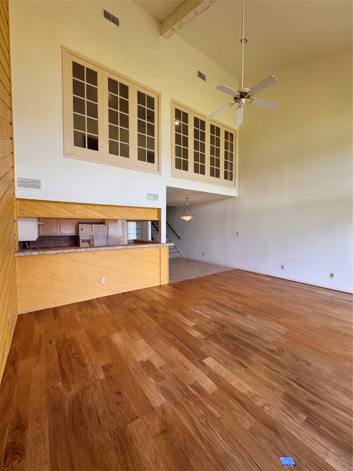 134 April Point Drive South Conroe, TX 77356 - Photo 9 of 31 a view of an empty room with a window and chandelier fan