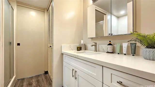 a kitchen with a sink and a refrigerator
