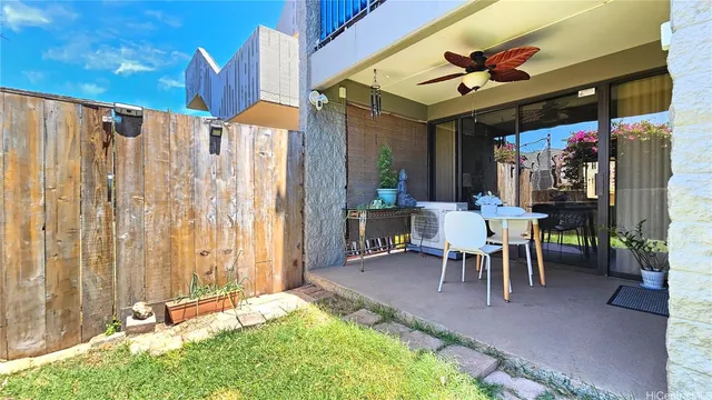 a view of a patio with table and chairs and potted plants