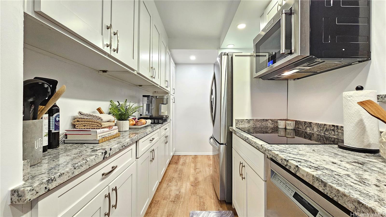 217 Prospect Street, Unit D16 Honolulu, HI 96813 - Photo 2 of 23 a kitchen with stainless steel appliances granite countertop a sink and stove
