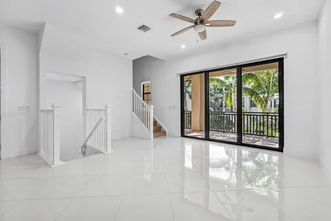 a view of empty room with floor to ceiling windows