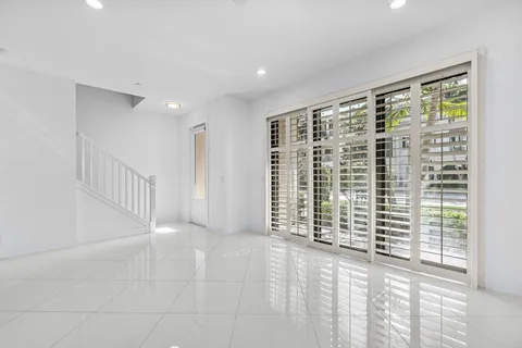 a view of an empty room with a balcony