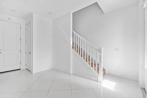 a view of a hallway with staircase