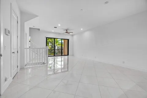 a view of an empty room with glass door