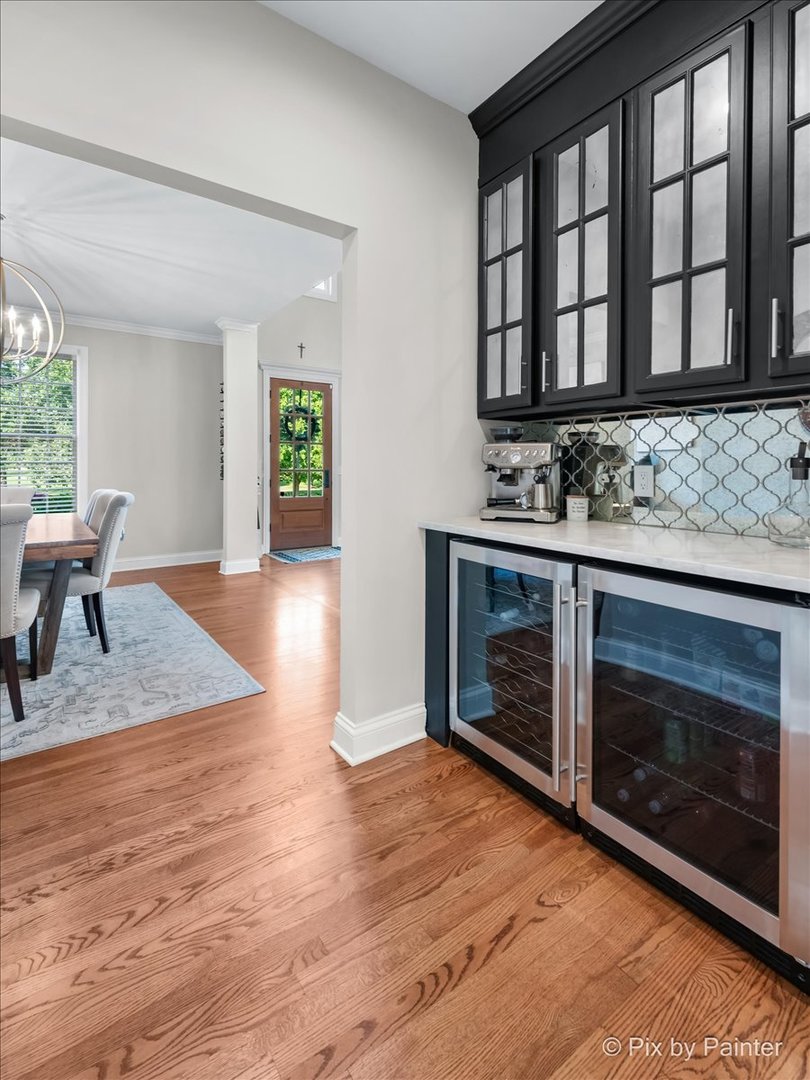 36W575 Bristol Road St. Charles, IL 60175 - Photo 12 of 58 a view of an empty room with wooden floor and a fireplace