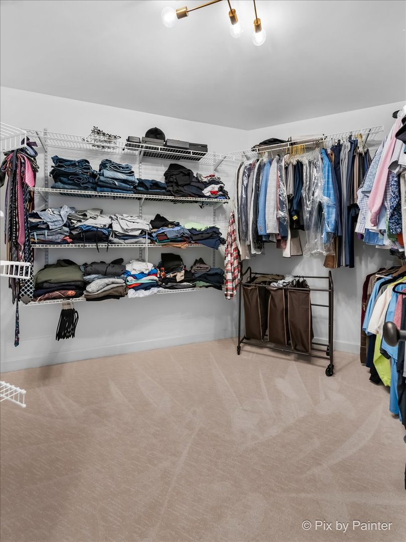 36W575 Bristol Road St. Charles, IL 60175 - Photo 26 of 58 a view of walk in closet with clothes and shoes