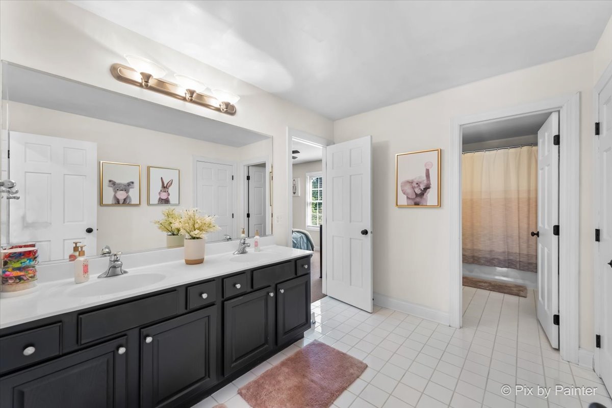 36W575 Bristol Road St. Charles, IL 60175 - Photo 35 of 58 a spacious bathroom with a granite countertop sink a mirror and a shower