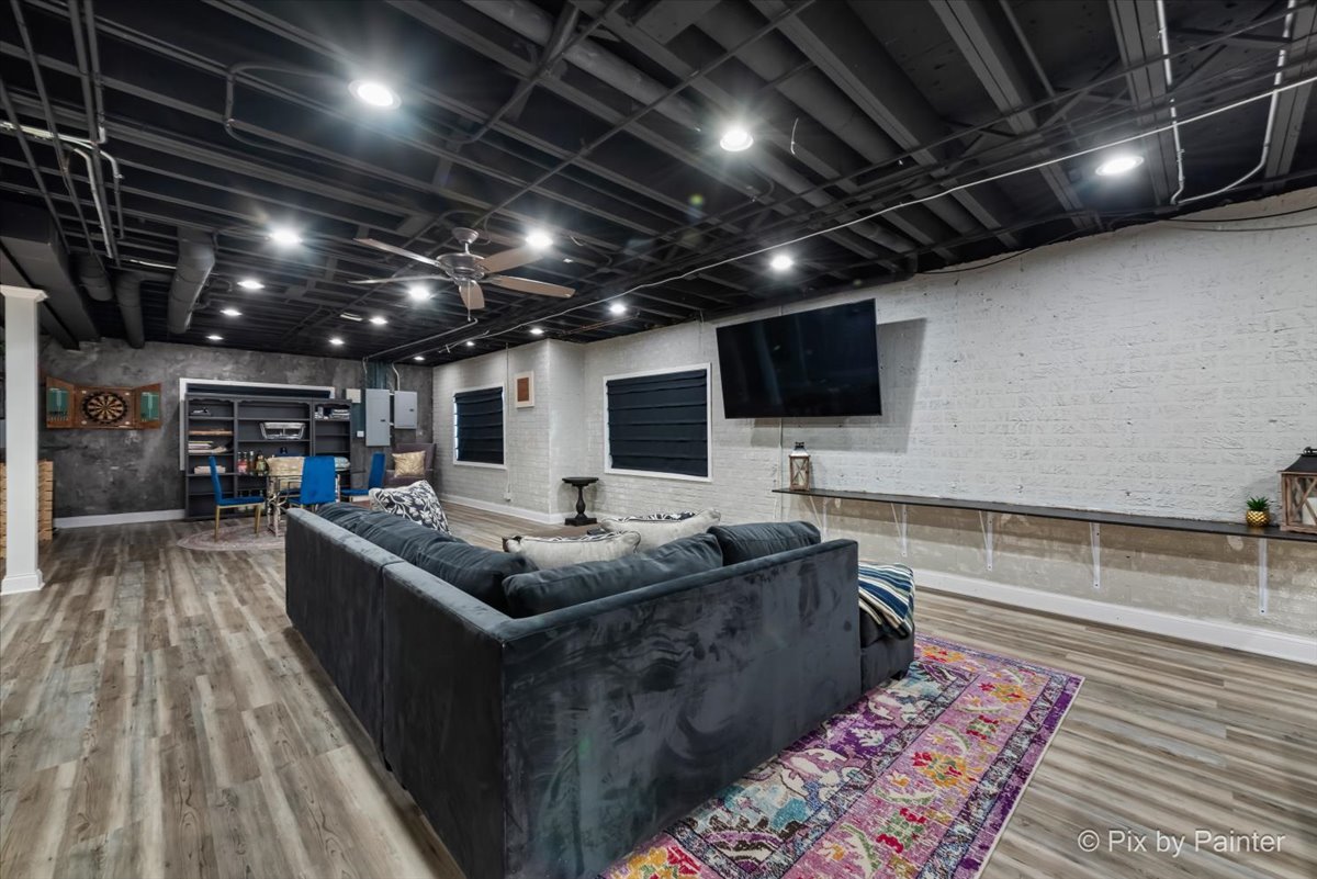 36W575 Bristol Road St. Charles, IL 60175 - Photo 38 of 58 a living room with stainless steel appliances kitchen island granite countertop a sink and a wooden floor