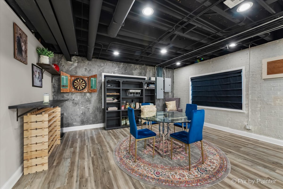 36W575 Bristol Road St. Charles, IL 60175 - Photo 39 of 58 a dining room with furniture a rug and wooden floor