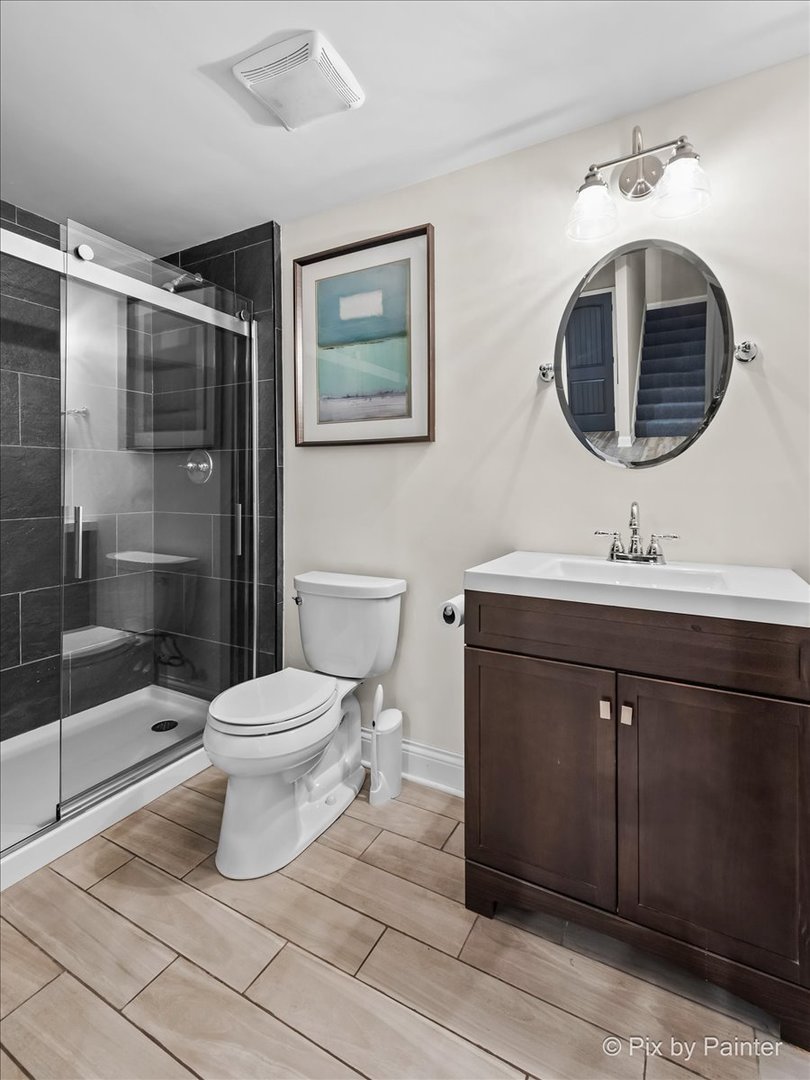 36W575 Bristol Road St. Charles, IL 60175 - Photo 42 of 58 a bathroom with a toilet sink and mirror