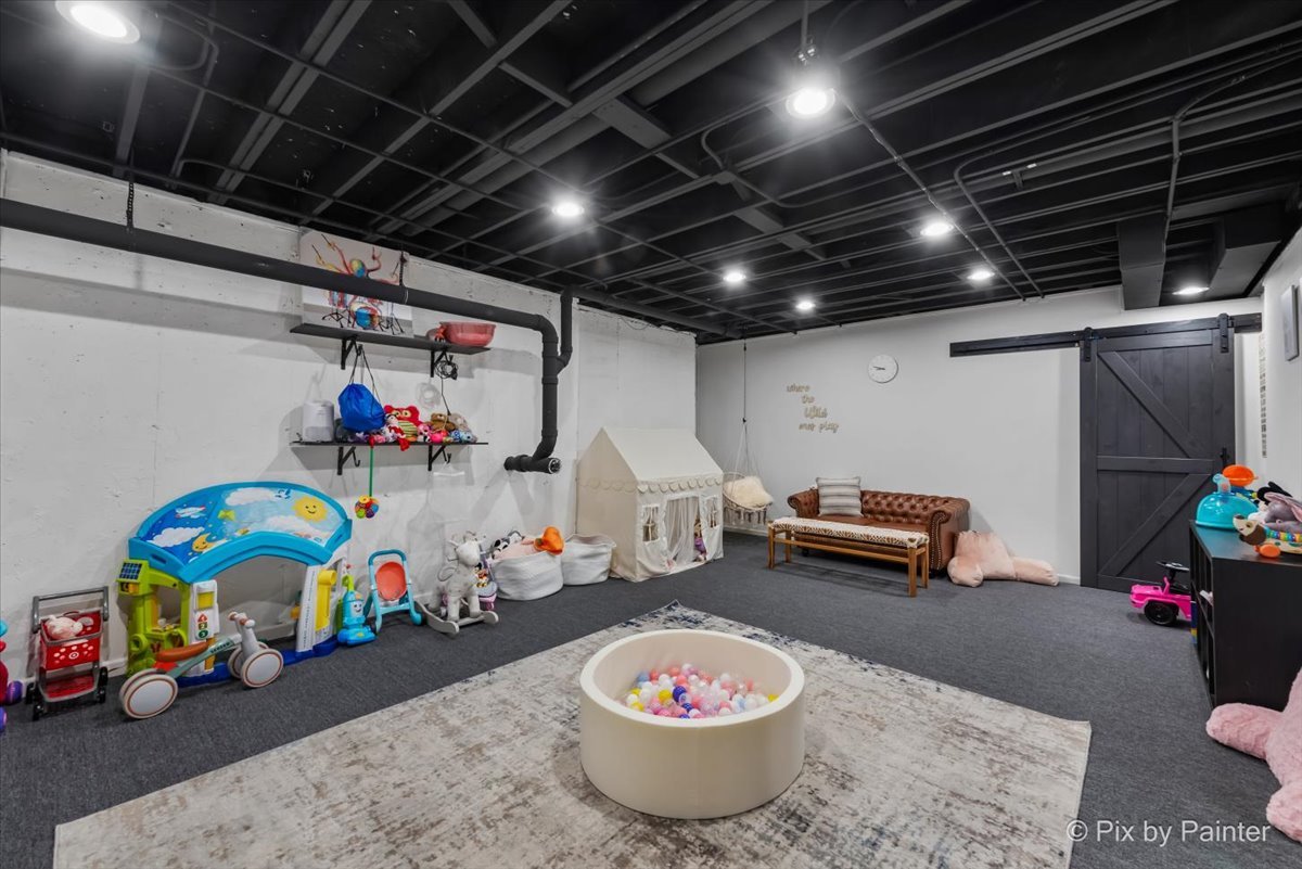 36W575 Bristol Road St. Charles, IL 60175 - Photo 43 of 58 a room with toys and a table and chairs