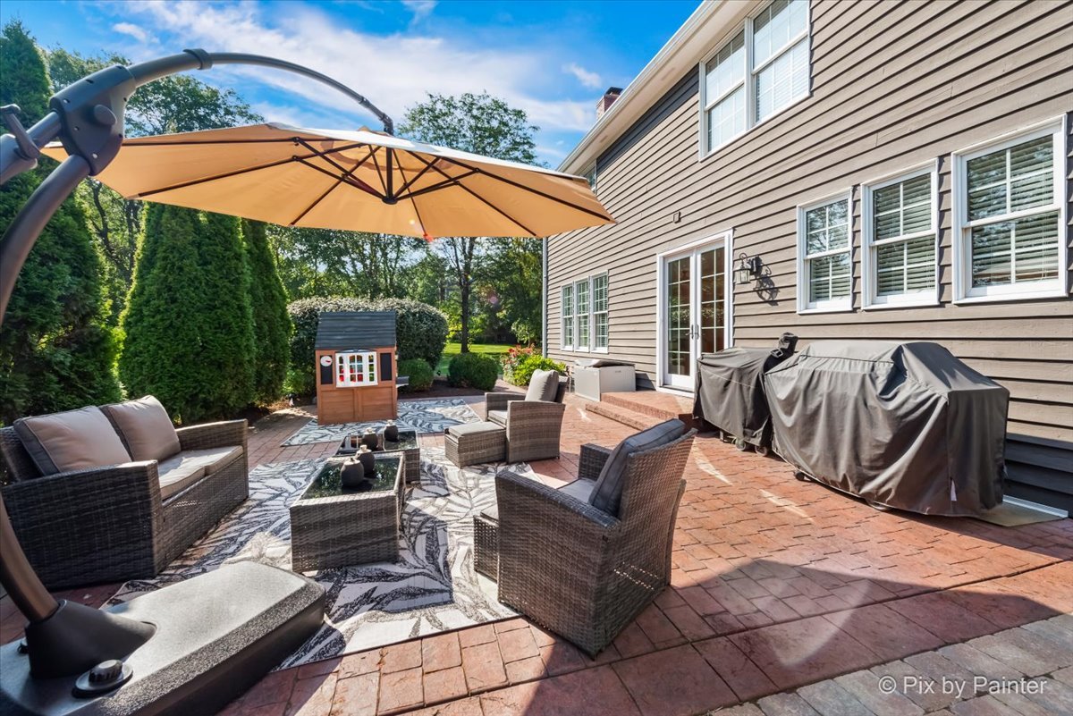 36W575 Bristol Road St. Charles, IL 60175 - Photo 47 of 58 a outdoor space with patio the couches and pool with an umbrella