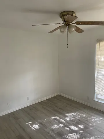 a view of a room with rack on the wall and a window