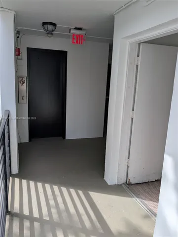 a view of a hallway with closet