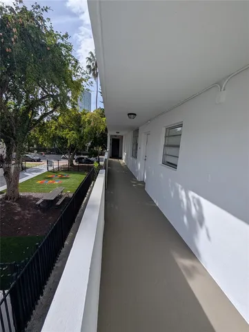 a view of swimming pool with seating space