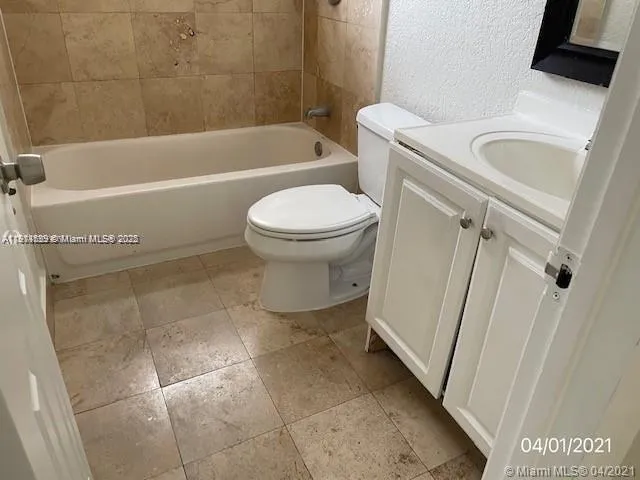 a bathroom with a sink a toilet and a bathtub