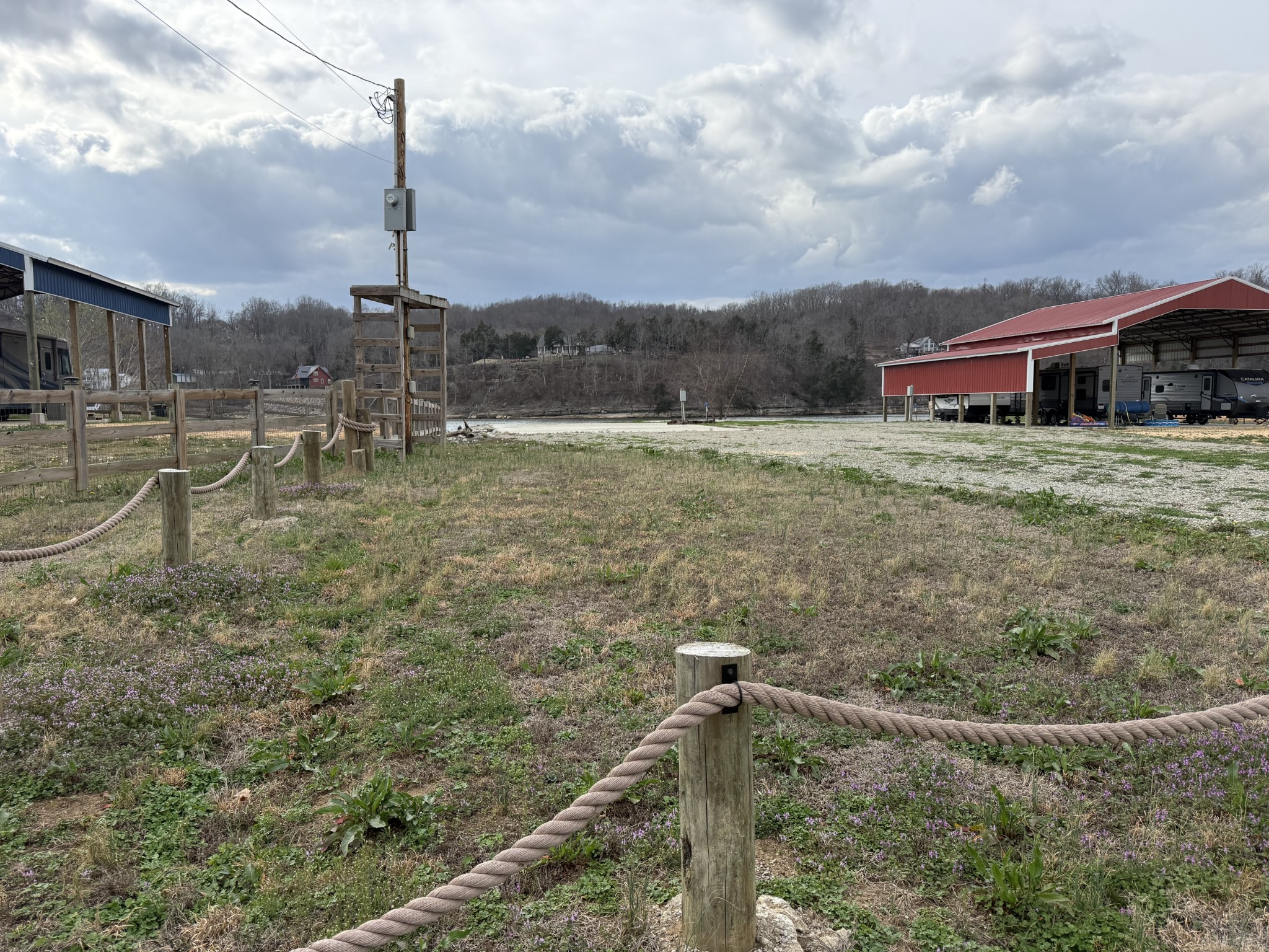 2133 Hardin Bottom River Road Clifton, TN 38425 - Photo 12 of 42 a backyard of a house with table and chairs