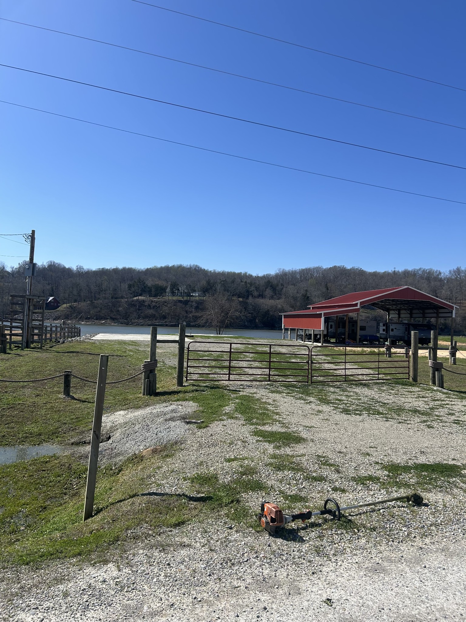 2133 Hardin Bottom River Road Clifton, TN 38425 - Photo 25 of 42 a view of a lake with a house in the background