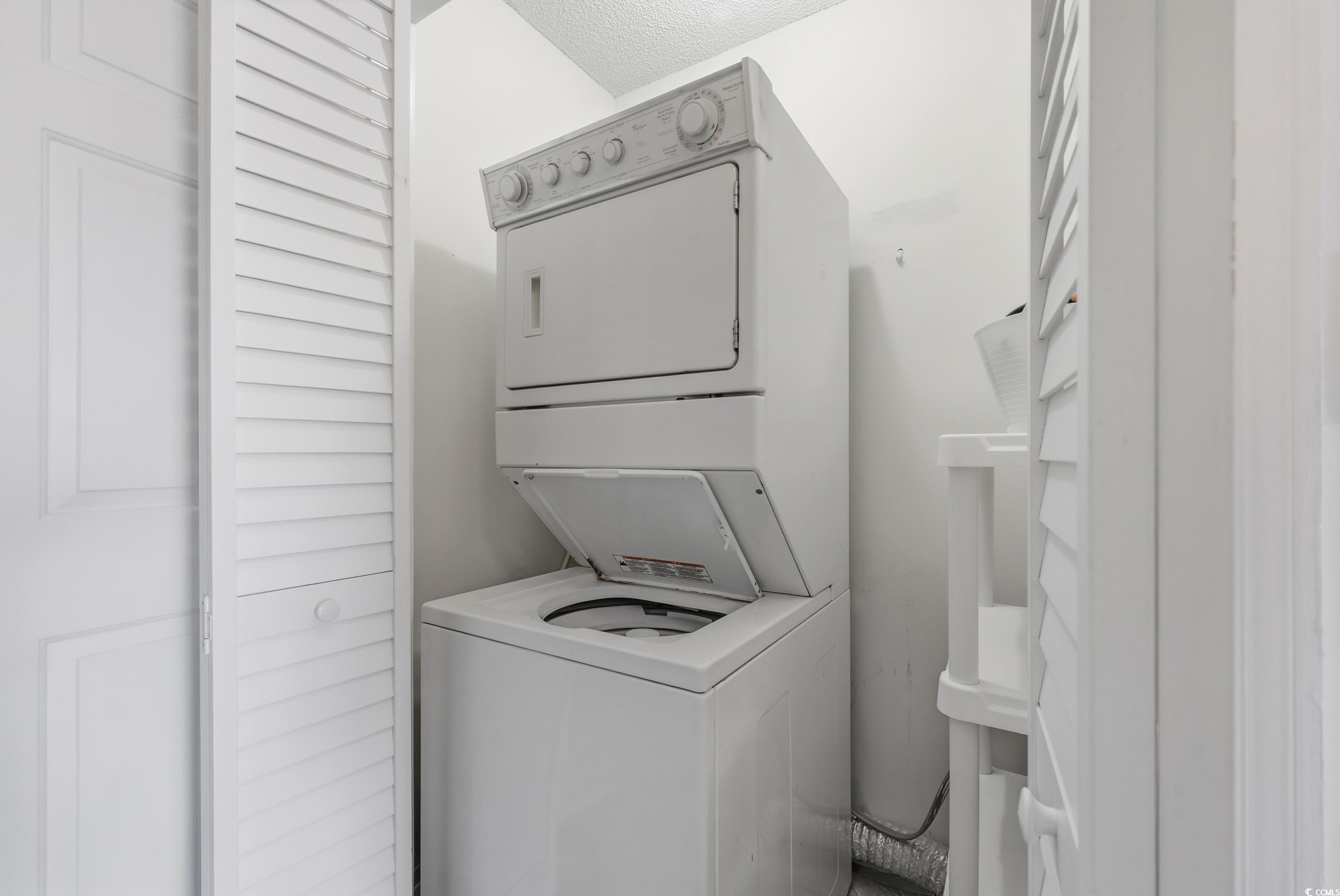 202 Double Eagle Drive, Unit C3 Surfside Beach, SC 29575 - Photo 11 of 20 Laundry area featuring stacked washer / dryer