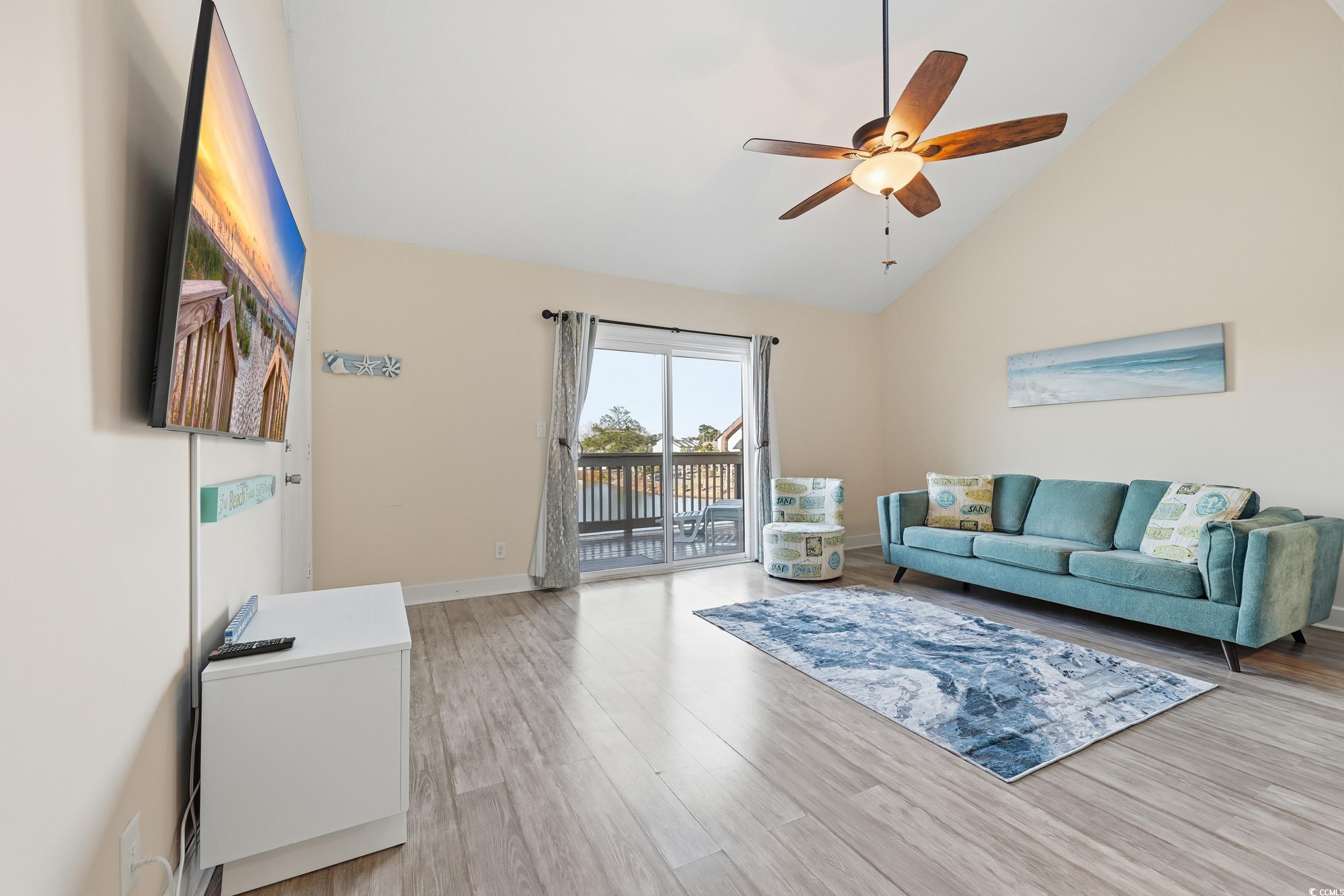 202 Double Eagle Drive, Unit C3 Surfside Beach, SC 29575 - Photo 5 of 20 Living area with a ceiling fan, high vaulted ceiling, and light wood-style floors