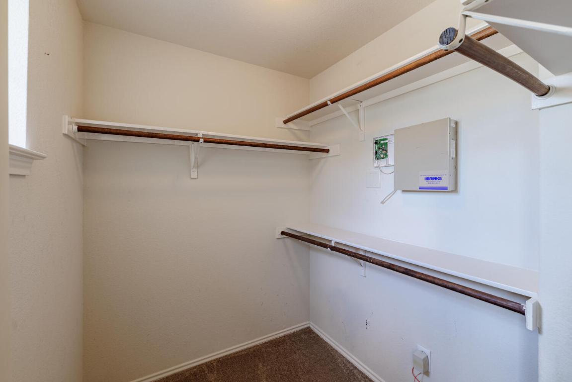 2632 Century Park Boulevard, Unit 18 Austin, TX 78727 - Photo 18 of 32 Spacious closet featuring dark carpet