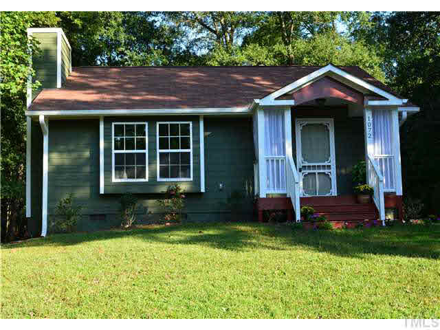 1072 Mills Street Raleigh, NC 27608 - Photo 1 of 25 a front view of a house with garden