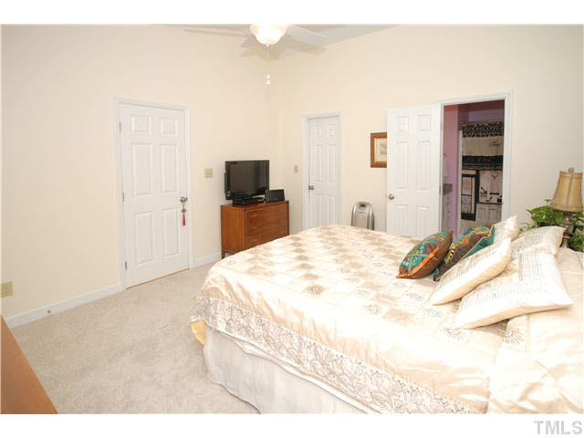 1072 Mills Street Raleigh, NC 27608 - Photo 15 of 25 a large white bed in a white room