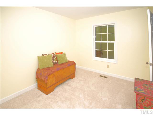 1072 Mills Street Raleigh, NC 27608 - Photo 17 of 25 a living room with a couch and a window