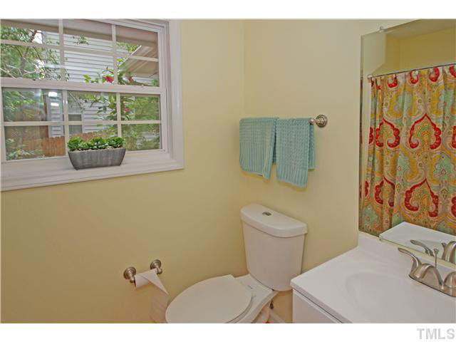 1072 Mills Street Raleigh, NC 27608 - Photo 18 of 25 a bathroom with a toilet and a sink