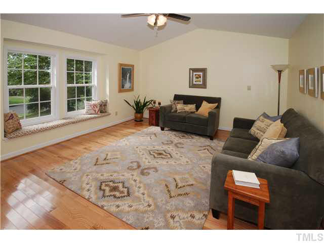 1072 Mills Street Raleigh, NC 27608 - Photo 5 of 25 a living room with furniture and a large window