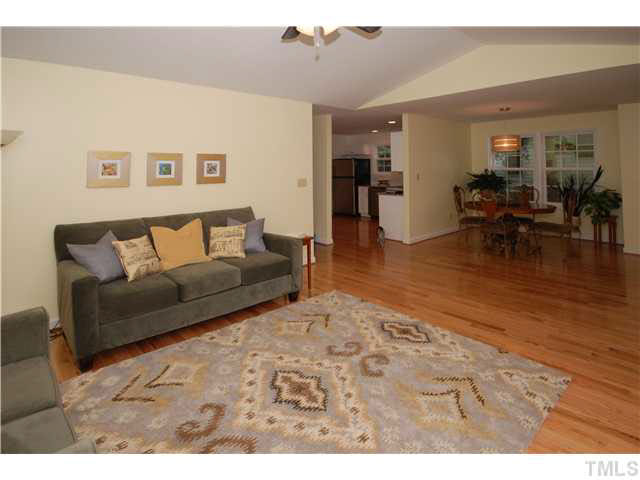 1072 Mills Street Raleigh, NC 27608 - Photo 6 of 25 a living room with furniture and a wooden floor